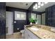 Stylish bathroom features granite countertop, modern fixtures, and neutral-toned tiling at 4430 Se 47Th Pl, Ocala, FL 34480
