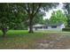 Charming one-story home with a well-maintained lawn and mature trees provides excellent curb appeal at 4430 Se 47Th Pl, Ocala, FL 34480