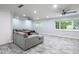 Expansive living room with tile floors, recessed lighting, ceiling fans, and large windows at 4430 Se 47Th Pl, Ocala, FL 34480
