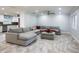 Living room featuring gray sectional sofa, tile flooring, recessed lighting, and ceiling fan at 4430 Se 47Th Pl, Ocala, FL 34480