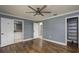 Spacious main bedroom with wood-look floors, en-suite bathroom and walk-in closet at 4430 Se 47Th Pl, Ocala, FL 34480