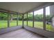 Screened porch overlooking the backyard and mature trees at 4430 Se 47Th Pl, Ocala, FL 34480