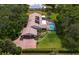 Aerial perspective featuring the house with its attached garage and screened-in pool at 4530 Nw 78Th Ave, Ocala, FL 34482