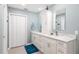Bright bathroom featuring a double vanity with marble countertops and modern fixtures at 4530 Nw 78Th Ave, Ocala, FL 34482