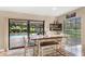 Breakfast nook with pool view and sliding doors that allow access to the backyard at 4530 Nw 78Th Ave, Ocala, FL 34482