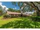 Inviting single-story home with lush front lawn and mature landscaping at 4530 Nw 78Th Ave, Ocala, FL 34482