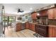 Spacious kitchen with granite countertops, stainless steel appliances, and breakfast nook with pool view at 4530 Nw 78Th Ave, Ocala, FL 34482