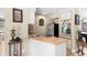Compact kitchenette with light wood countertops, wine rack, and modern refrigerator at 4530 Nw 78Th Ave, Ocala, FL 34482