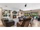 Cozy living room with fireplace, built-in shelving, and patio access at 4530 Nw 78Th Ave, Ocala, FL 34482