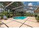 Enclosed pool area with a fountain and spacious seating at 4530 Nw 78Th Ave, Ocala, FL 34482