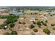 An aerial view showcases the property, lakes, surrounding landscape, and neighborhood at 5489 Nantahala Ln, Lady Lake, FL 32159