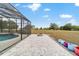 Backyard patio featuring brick pavers, an outdoor fire pit, and pool at 5489 Nantahala Ln, Lady Lake, FL 32159