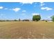 Expansive backyard and pool area with surrounding mature landscaping at 5489 Nantahala Ln, Lady Lake, FL 32159