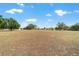 Large grassy backyard with mature trees offering ample space at 5489 Nantahala Ln, Lady Lake, FL 32159
