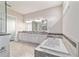 Bright bathroom with dual sinks, soaker tub, large shower, and granite countertops at 5489 Nantahala Ln, Lady Lake, FL 32159