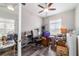 Cozy bedroom or office space with wood floors, ceiling fan, and lots of storage at 5489 Nantahala Ln, Lady Lake, FL 32159
