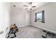 Versatile room that can be used as a bedroom or home gym, showcasing the carpet flooring and natural light at 5489 Nantahala Ln, Lady Lake, FL 32159