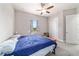 Light-filled bedroom features neutral walls, carpet floors, a closet, and a window at 5489 Nantahala Ln, Lady Lake, FL 32159
