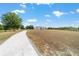 Large property with meticulously maintained lawn, driveway, and fence at 5489 Nantahala Ln, Lady Lake, FL 32159