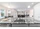Granite counters accent this kitchen view into the dining and living area with stainless appliances at 5489 Nantahala Ln, Lady Lake, FL 32159