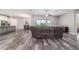 Open-concept living room featuring wood flooring, recessed lighting, and a ceiling fan at 5489 Nantahala Ln, Lady Lake, FL 32159
