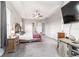 This large main bedroom suite features a tray ceiling, ceiling fan, and views of the backyard at 5489 Nantahala Ln, Lady Lake, FL 32159