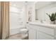 Bright bathroom featuring modern fixtures, neutral tones, and a shower-tub combination for relaxation at 615 Marion Oaks Blvd, Ocala, FL 34473