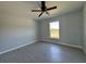 Bright bedroom with tile flooring, natural light, and ceiling fan at 6178 Sw 207Th Ct, Dunnellon, FL 34431