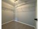 Organized closet with wire shelving and tile flooring at 6178 Sw 207Th Ct, Dunnellon, FL 34431