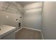 Functional laundry room with tile flooring and countertop space at 6178 Sw 207Th Ct, Dunnellon, FL 34431