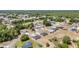 Aerial view displays a lovely, quiet neighborhood with well-spaced homes, green trees, and winding roads at 6570 Sw 129Th Loop, Ocala, FL 34473