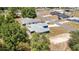 Aerial view of the property and adjacent homes surrounded by lush trees at 6570 Sw 129Th Loop, Ocala, FL 34473