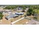 An aerial view showcases the single-Gathering homes and surrounding neighborhood at 6570 Sw 129Th Loop, Ocala, FL 34473