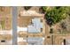 A bird's eye view features a home with a well-kept lawn in a peaceful neighborhood with manicured street landscaping at 6570 Sw 129Th Loop, Ocala, FL 34473