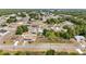 An aerial view highlights a nice neighborhood with lush surroundings at 6570 Sw 129Th Loop, Ocala, FL 34473