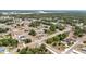 An aerial view of a residential area surrounded by lush trees at 6570 Sw 129Th Loop, Ocala, FL 34473