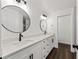 Bathroom featuring double sinks, white cabinetry, quartz countertops, and modern fixtures at 6570 Sw 129Th Loop, Ocala, FL 34473