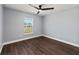 Bedroom with window and modern ceiling fan at 6570 Sw 129Th Loop, Ocala, FL 34473