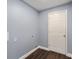 Practical laundry room featuring blue walls and vinyl wood flooring at 6570 Sw 129Th Loop, Ocala, FL 34473