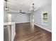 Living room view featuring hardwood floors, stainless steel appliances and lots of light at 6570 Sw 129Th Loop, Ocala, FL 34473