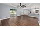 Open concept living room featuring hardwood floors, and sliding glass doors to the lanai at 6570 Sw 129Th Loop, Ocala, FL 34473