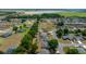 An aerial view captures a charming neighborhood with well-maintained homes and green spaces at 6791 Se 100Th Pl, Belleview, FL 34420