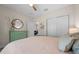 Spacious bedroom featuring neutral walls, a ceiling fan, closet, and a view of the house interior through a doorway at 6791 Se 100Th Pl, Belleview, FL 34420