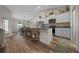 A kitchen boasts stainless steel appliances, granite countertops, and an island with bar stool seating at 6791 Se 100Th Pl, Belleview, FL 34420