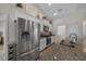 A kitchen shows stainless steel appliances, granite countertops, and white cabinets at 6791 Se 100Th Pl, Belleview, FL 34420