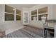 Enjoy outdoor relaxation on the screened patio with stylish furniture and a view of the backyard at 6791 Se 100Th Pl, Belleview, FL 34420