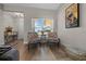 Cozy sitting area with decorative chairs and bright window with natural light showcasing modern interior design at 6791 Se 100Th Pl, Belleview, FL 34420