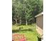 Spacious backyard with wooded area, nice lawn and fence line at 7488 Sw 204Th Ave, Dunnellon, FL 34431