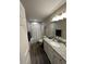 Clean bathroom with granite counters, updated fixtures, and tub shower with updated gray tile at 7488 Sw 204Th Ave, Dunnellon, FL 34431