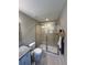 Modern bathroom featuring tiled shower with sliding glass doors and granite vanity at 7488 Sw 204Th Ave, Dunnellon, FL 34431